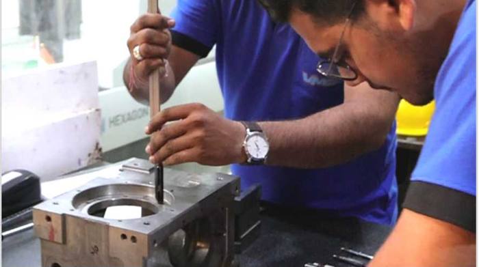 VMSL inspectors checking a bore with a vernier caliper